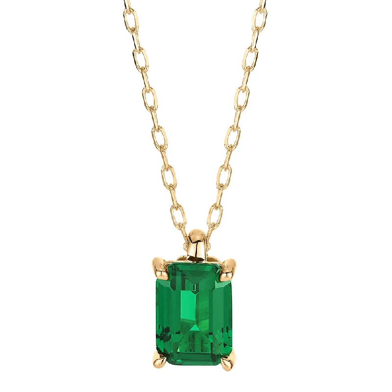 Flecked chain necklace-Emerald Cut solitaire pendant with emerald simulant in 10 carat yellow gold