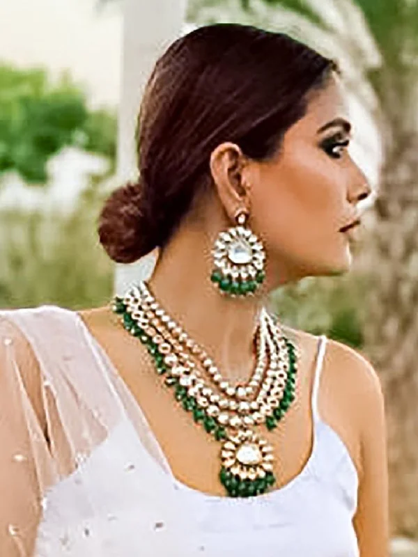 Pine cluster necklace-Pooja Raina in Kundan layered Necklace with Green Hangings.